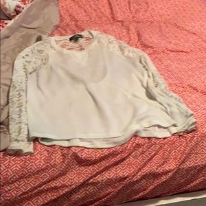 Its a blouse with lace sleeves